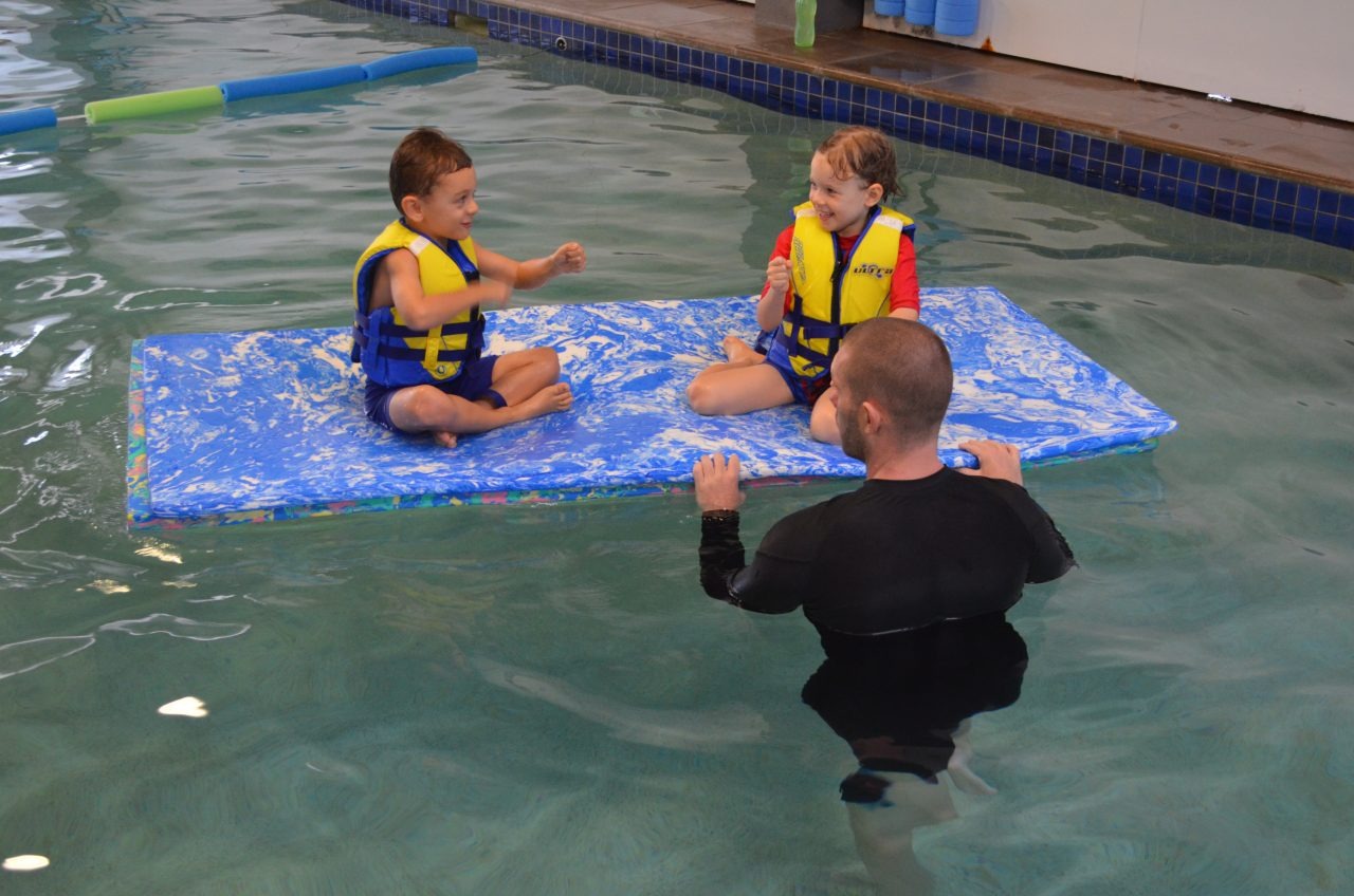 Parent and baby in a gentle swim lesson at Little Pearls